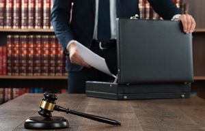 Lawyer Putting Documents In Briefcase