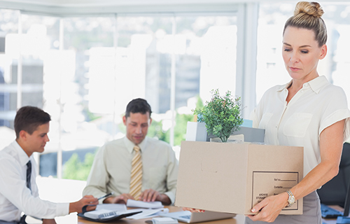 Businesswoman carrying box